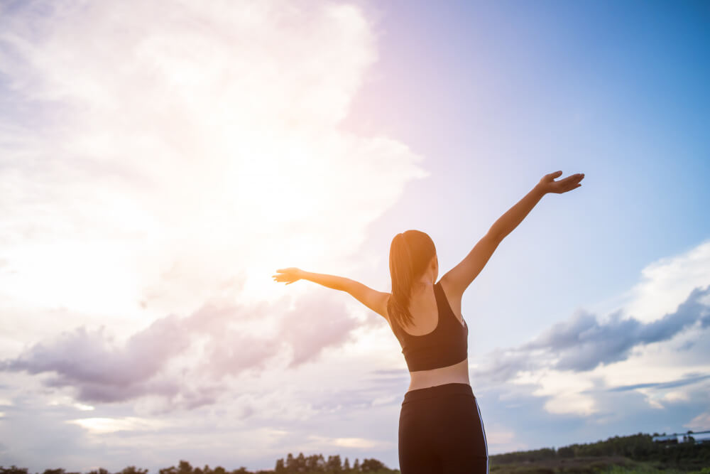 happy-smiling-athletic-woman-with-arms-outstretched happy-smiling-athletic-woman-with-arms-outstretched